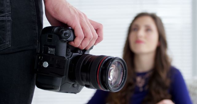 Professional Photographer Holding Camera Ready for Portrait Session - Download Free Stock Images Pikwizard.com