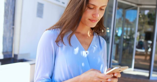 Smiling Woman Checking Smartphone in Urban Setting - Download Free Stock Images Pikwizard.com