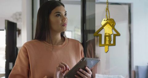 Young Woman Contemplating Homeownership with Digital Tablet