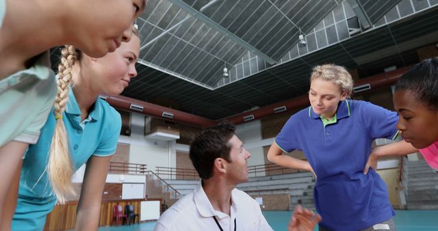 Coach Giving Strategy to Diverse Teen Athletes in Gymnasium - Download Free Stock Images Pikwizard.com