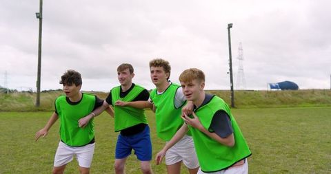 Teenage Sports Team in Unity During Training Session Outdoors