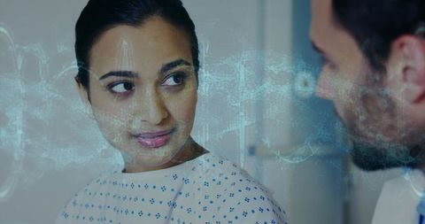 Patient and Doctor Reviewing Holographic Medical Data in Clinic