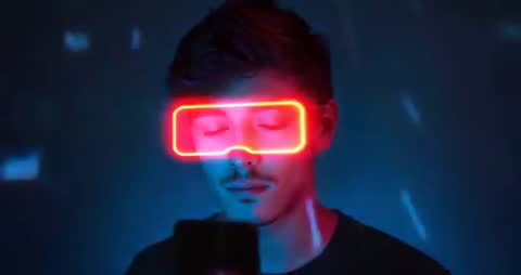 Man Holding Microphone with Neon Glasses Effect in Futuristic Neon Studio