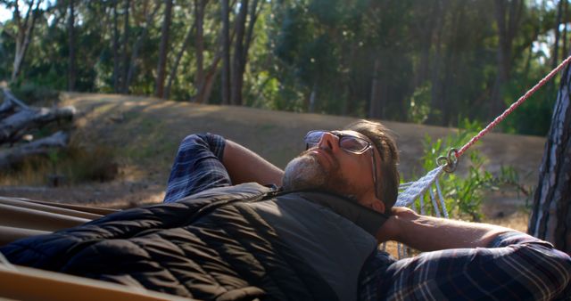 Man Relaxing in Hammock in Tranquil Forest Setting - Download Free Stock Images Pikwizard.com