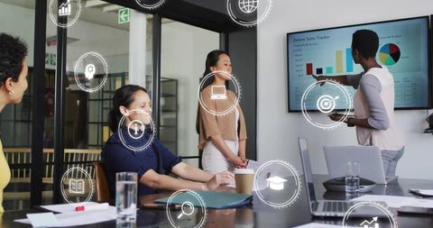 Presenting Sales Dashboard in Modern Conference Room, Team Collaborating on Growth Strategy