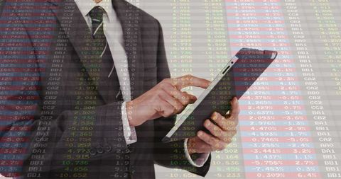 Executive Tapping Tablet While Analyzing Real-Time Stock Market Data Overlay