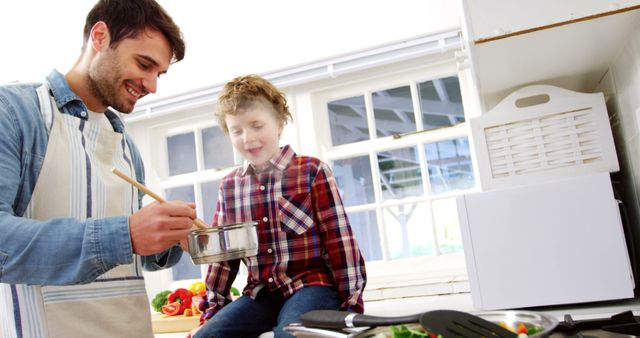 Father Cooking with Son in Bright Modern Kitchen - Download Free Stock Images Pikwizard.com