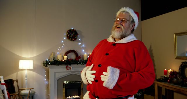 A jovial Santa Claus enhances the festive ambiance in a decorated room. - Download Free Stock Photos Pikwizard.com