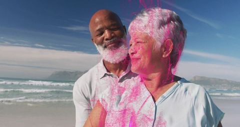 Affectionate Senior Couple Enjoying Scenic Beach Outing