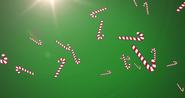 Falling Candy Canes on Green Background with Glowing Light - Download Free Stock Images Pikwizard.com