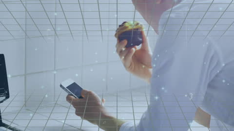 Man Holding Smartphone and Apple in Digital Network Concept