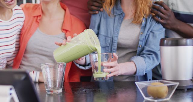 Friends Pouring Healthy Green Smoothies in Kitchen - Download Free Stock Images Pikwizard.com