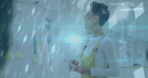 Innovative Woman Reviewing Photos on Glass Wall with Digital Overlay