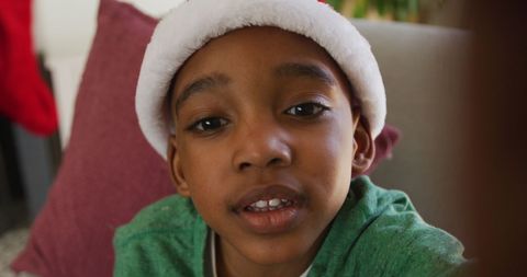 Smiling Boy in Santa Hat Making Video Call During Christmas