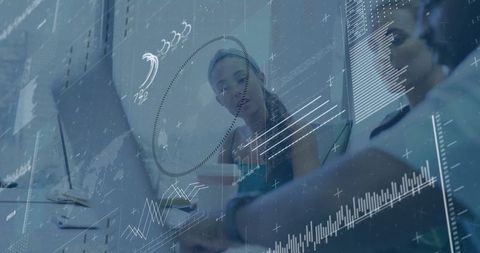 Business Team Analyzing Financial Data on Transparent Digital Interface