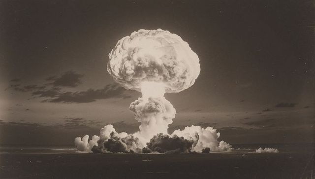 Dramatic Mushroom Cloud Over Ocean at Night