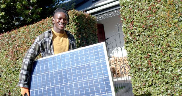 Smiling Man Installing Solar Panel in Residential Area - Download Free Stock Images Pikwizard.com