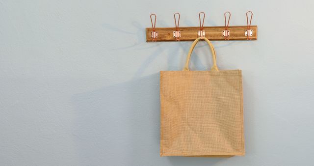 Eco-friendly Reusable Shopping Bag Hanging on Wall Hook - Download Free Stock Images Pikwizard.com