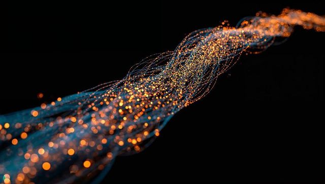 Twisting glowing fiber-optic stream with blue threads and orange bokeh for tech design