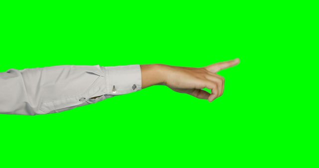 This image features a hand in a formal shirt pointing with the index finger against a green screen background. The green screen allows for easy editing and background replacement, making it versatile for various creative uses, such as advertising, presentations, and tutorials requiring directional gestures.
