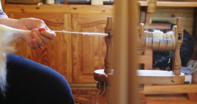 Close-Up Hand Spinning Wool Using Traditional Spinning Wheel - Download Free Stock Images Pikwizard.com