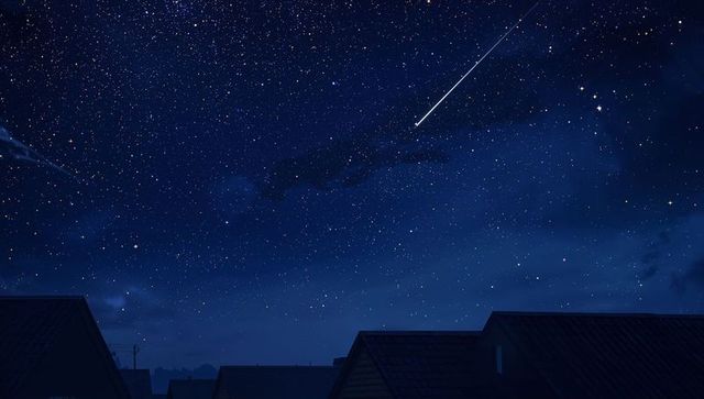 Shooting Star Above Rooftops in Starry Night Sky