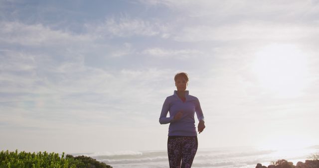 Woman Jogging Along Seaside Path at Sunrise - Download Free Stock Images Pikwizard.com