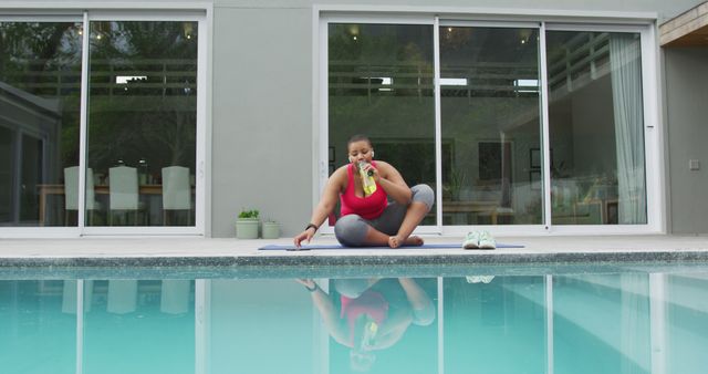 Woman Relaaxing by Poolside with Healthy Drink after Workout - Download Free Stock Images Pikwizard.com