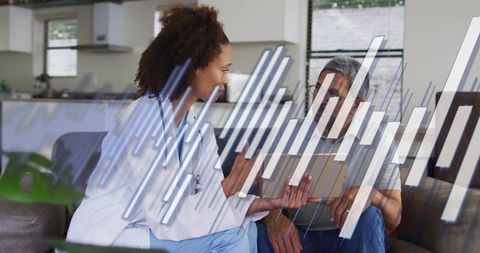 Healthcare Professional Engages in Telemedicine with Senior a Patient at Home