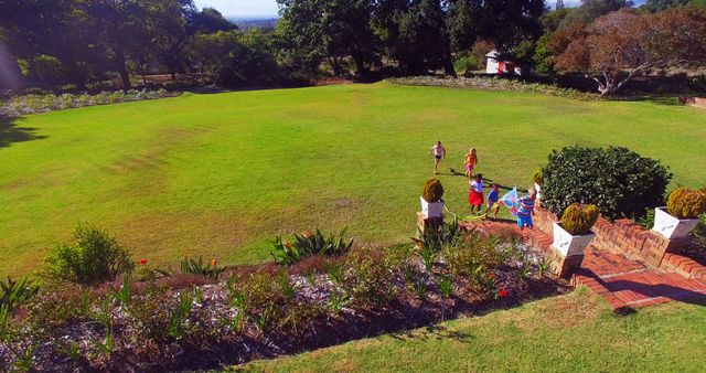 Family Flying Kites on Sprawling Green Lawn - Download Free Stock Images Pikwizard.com