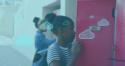 Schoolgirl unlocking red locker with blue backpack