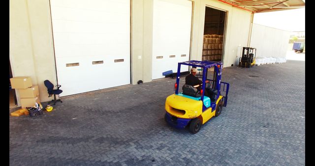 Worker Driving Forklift in Industrial Warehouse Dock Area - Download Free Stock Images Pikwizard.com