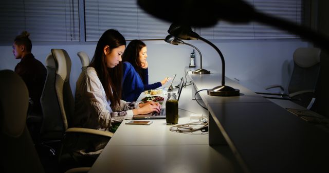 Young Professionals Working Late in Modern Office - Download Free Stock Images Pikwizard.com