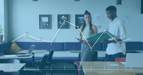 Coworkers Analyzing Graphs in Modern Office Lounge Area