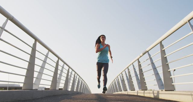 Young Woman Running on Bridge for Exercise and Fitness - Download Free Stock Images Pikwizard.com