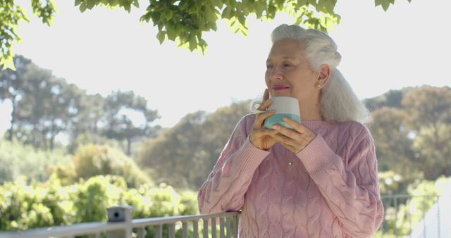 Senior woman enjoying her morning coffee outdoors - Download Free Stock Images Pikwizard.com