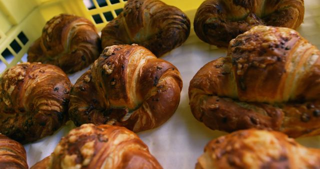Delicious, freshly baked croissants on tray in bakery. Bakery, baking, work, food and local business.