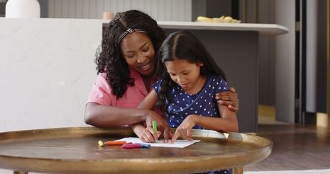 Grandmother and Granddaughter Bonding Through Drawing at Home