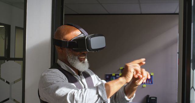 Senior Man Experiencing Virtual Reality in Office Environment - Download Free Stock Images Pikwizard.com
