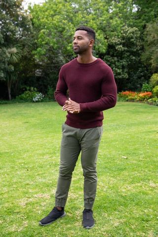 Man in garden lawn enjoying nature in tranquil surroundings