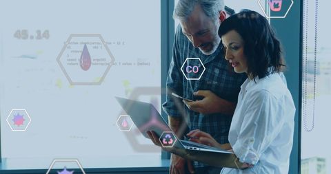 Colleagues Analyzing Ecological Data on Laptop with Icons Overlay