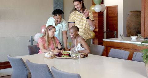 Friends enjoying lively conversation during cozy home gathering