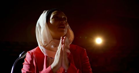 Confident businesswoman wearing hijab speaking at seminar