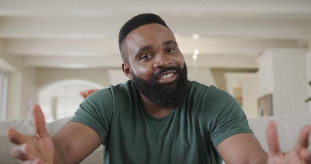 Cheerful Bearded Man in Casual Green Shirt Smiling Indoors - Download Free Stock Images Pikwizard.com