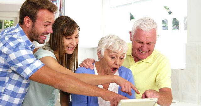 Happy Family Seniors Grandkids Together Using Tablet Kitchen - Download Free Stock Images Pikwizard.com