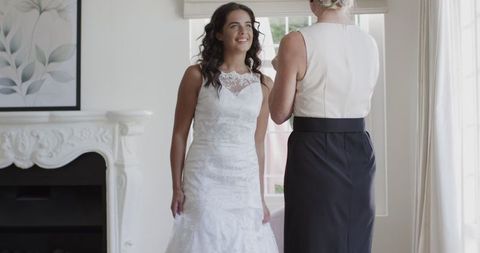 Bride Smiling in Elegant Room while Preparing on Wedding Day