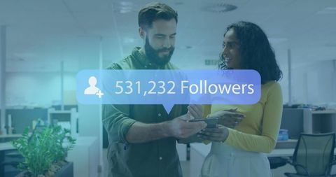 Colleagues Discussing Social Media Metrics in Modern Office