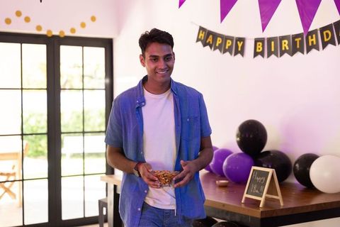 Cheerful Teenage Boy Enjoying Birthday Party Celebration