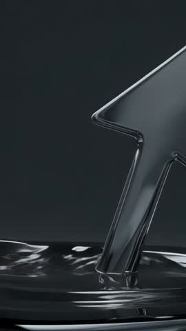 Vertical video: Metallic arrow rising from rippling black liquid with glossy reflections