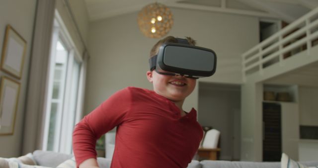 Child Enthusiastically Playing VR Game in Modern Living Room - Download Free Stock Images Pikwizard.com